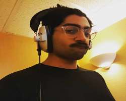 He is seen wearing glasses in his post.